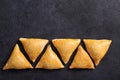 Very tasty samosa on a black background, top view. Place for text