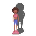 very thin Afro American Black woman with a mental disorder of anarexia and bulimia stands on the scales, feeling fat, feeling a
