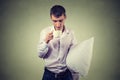 Very tired, falling asleep business man holding a cup of coffee and pillow Royalty Free Stock Photo