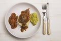 Mashed potato, onion gravey, grilled sausages, mushy peas and chopped rosemary Royalty Free Stock Photo