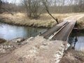 A very unsafe iron bridge over a stream Royalty Free Stock Photo