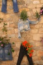 A creative way to display flowers on the outsidre wall.