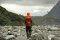 Young asian boy carried by his father on his shoulders heading to Franz Josef Glacier in New Zealand