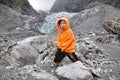 Asian boy posing cheekily in front of franz joseph glacier, New Zealand Royalty Free Stock Photo