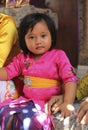 A very young girl in traditional Balinese clothes on Potong Gigi ceremony - Cutting Teeth, Bali Island, Indonesia Royalty Free Stock Photo