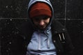 Very young hungry and scared homeless teenager girl standing alone on the street in the cold winter day feeling abandoned and anxi Royalty Free Stock Photo