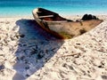 Wooden fishing boat on the beach in the sand Royalty Free Stock Photo