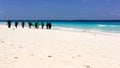 A group of indigenous women carrying a fishing net