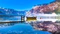 A lonesome boat reflection by early morning light Royalty Free Stock Photo