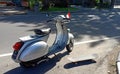 Vespa clasic and skateboard