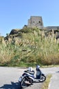 Vespa in front of Torre Talao in Scalea, Calabria Royalty Free Stock Photo