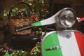 Vespa Piaggio motorcycle with a basket of chilies on display in Tropea, Calabria