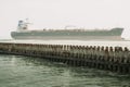 Vessel ship sails close to the Dutch coast near a port city of Vlissingen in the province of Zeeland, Netherlands Royalty Free Stock Photo