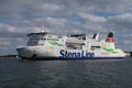 The vessel Skane is leaving Rostock-Warnemuende on a partly cloudy summer day in august