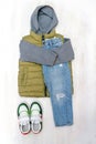 Vest,jumper,hooded sweatshirt,knitted,blue jeans pants with sneakers.Set of baby children& x27;s clothes,clothing Royalty Free Stock Photo