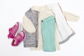 Vest,warm jumper,sweater,jeans pants,pink sneakers.Set of baby children's clothes,clothing for spring,autumn,winter on white Royalty Free Stock Photo