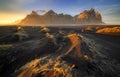 Vestrahorn mountain with black volcanic lava sand dunes at sunset, Iceland Royalty Free Stock Photo