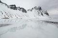 Vestrahorn mountains with reflection in the frozen water, Stokksnes Peninsula in winter, Iceland Royalty Free Stock Photo