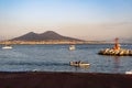 Vesuvius seen and fish boats from the seafront of Naples, Italy