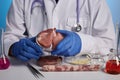 Vet Doctor Demonstrates Fake Meat in Petri - Labs Photo