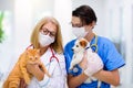 Vet with dog and cat. Puppy and kitten at doctor Royalty Free Stock Photo