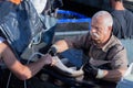 Vet examinating sturgeon in fish farm