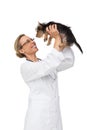 Vet lifting up yorkshire terrier puppy and smiling Royalty Free Stock Photo