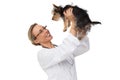 Vet lifting up yorkshire terrier and smiling Royalty Free Stock Photo