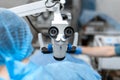 Vet ophthalmologist surgical microscope in operating room. and dog with injured eye on operating table, ready for operation Royalty Free Stock Photo