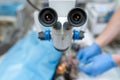 Vet ophthalmologist surgical microscope in operating room. and dog with injured eye on operating table, ready for operation Royalty Free Stock Photo