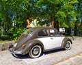 Veteran classic old car Volkswagen Beetle two colors parked