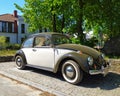 Veteran classic old car Volkswagen Beetle Type 1 two colors parked