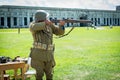 Veteran demostrating vintage assult rifle from WWII