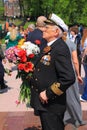 The veteran with flowers in the Victory Day