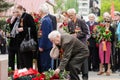 Veteran lays flowers at the monument to fallen soldiers