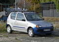 Old small silver grey car Fiat Seicento 600 parked front view Royalty Free Stock Photo