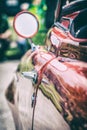 Veteran red car with rear-view mirror and handle Royalty Free Stock Photo