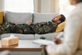 Veteran, therapy and talk to psychologist on couch and mental health support for military, consultation or listen to Royalty Free Stock Photo