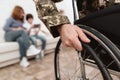 Veteran in wheelchair returned from army. Close-up photo veteran in a wheelchair. Royalty Free Stock Photo