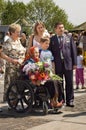 Veteran woman with her family during Victory Day celebration