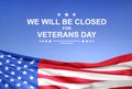 Veterans Day background with USA flag. We will be closed for Veterans Day