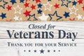 Veterans Day closed message with stars on a weathered whitewash wood Royalty Free Stock Photo