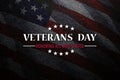 Veterans Day Honoring All Who Served inscription on black textured background with USA flag. American holiday poster. Royalty Free Stock Photo