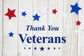 Veterans Day message with stars on a weathered whitewash wood