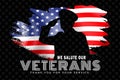 Veterans Day. A soldier salutes in front of the American flag Royalty Free Stock Photo