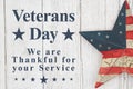 Veterans Day message with old retro star on a weathered whitewash wood