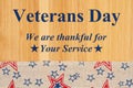 Veterans day type message with retro USA stars and stripes ribbon Royalty Free Stock Photo