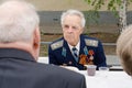 Veterans talk while sitting at table a gala event