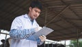 Veterinarian checking on his livestock and quality of milk in the dairy farm .Agriculture industry, farming and animal husbandry Royalty Free Stock Photo