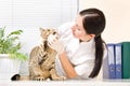 Veterinarian checks teeth cat